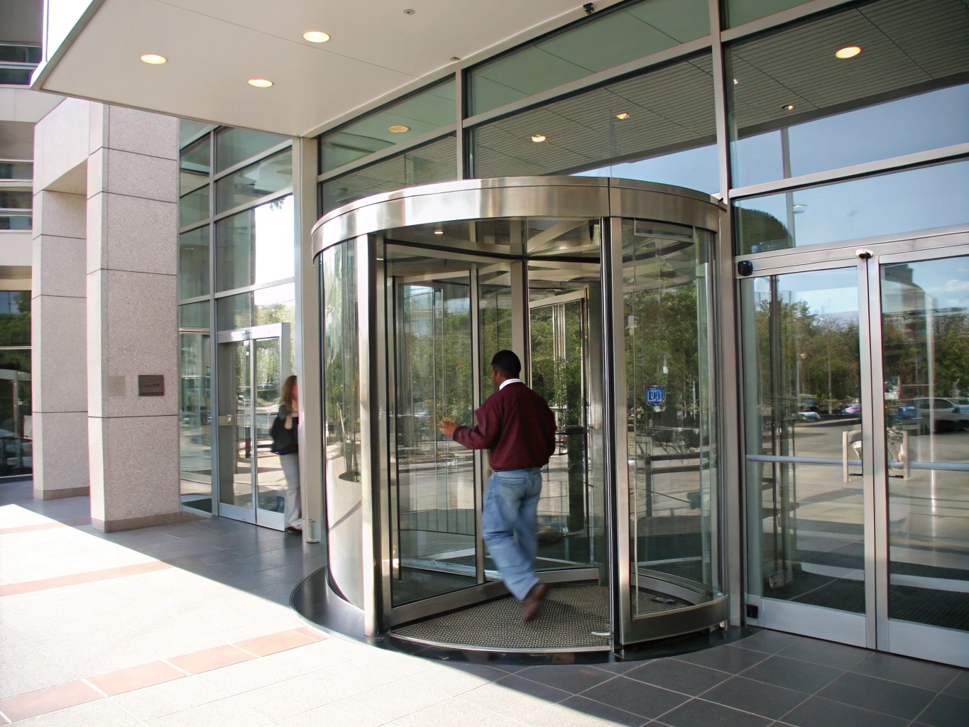 High-capacity revolving glass door at corporate office entrance